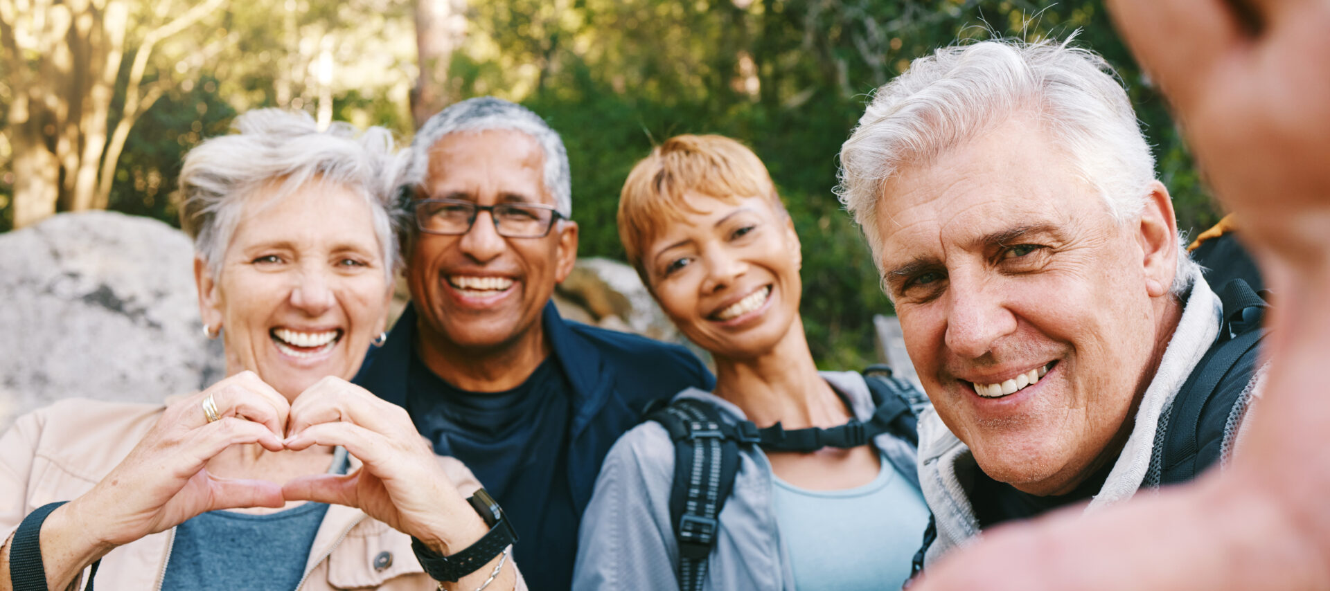 nature-selfie-and-senior-friends-hiking --Miami elderly community-together-in-a-forest-while-on-an-outdoor-adventure-happy-smile